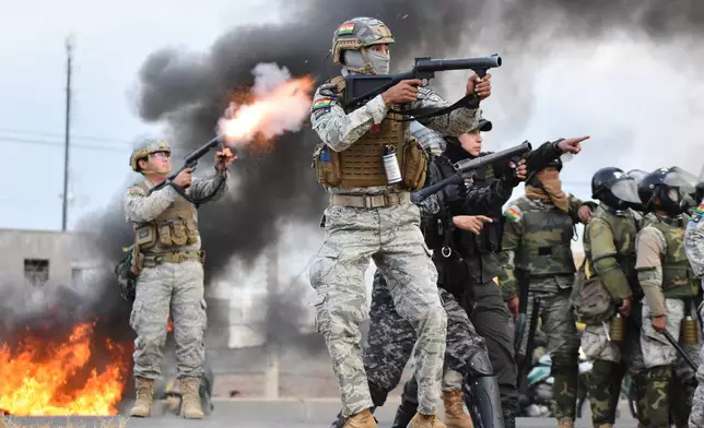 Police fire tear gas at anti-government protesters blocking a highway in Vinto, Bolivia, Monday, June 8, 2026. (AP Photo/Dico Soliz)