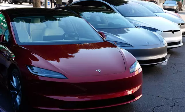 FILE - Tesla vehicles are displayed at the AutoMobility LA Auto Show, Thursday, Nov. 21, 2024, in Los Angeles. (AP Photo/Damian Dovarganes, File)