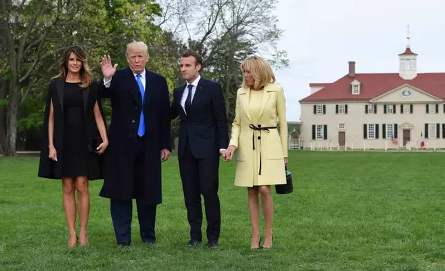 FILE - From left, first lady Melania Trump, President Donald Trump, French President Emmanuel Macron, and his wife Brigitte Macron, pose for a photo during a visit and private dinner at George Washington's Mount Vernon estate in Mount Vernon, Va., April 23, 2018. (AP Photo/Susan Walsh, file)