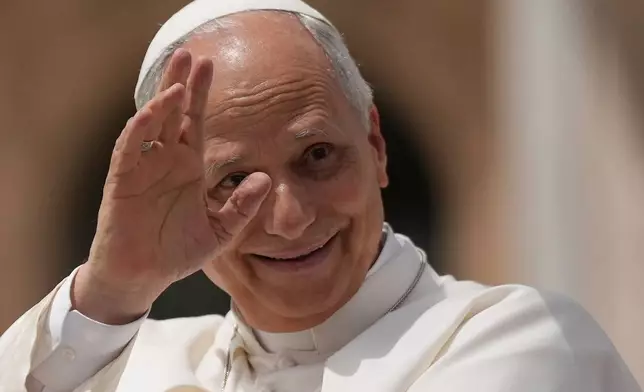 Pope Leo XIV waves as he leaves after his weekly general audience in St. Peter's Square at The Vatican, Wednesday, June 3, 2026. (AP Photo/Andrew Medichini)