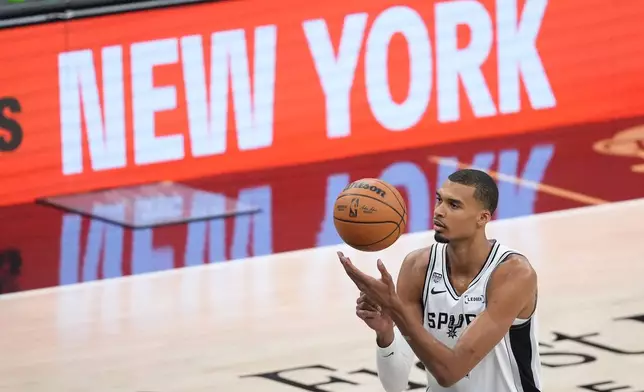 San Antonio Spurs forward Victor Wembanyama shoots a free throw during the first half of Game 2 of the NBA Finals basketball series against the New York Knicks, Friday, June 5, 2026, in San Antonio. (AP Photo/Eric Gay)