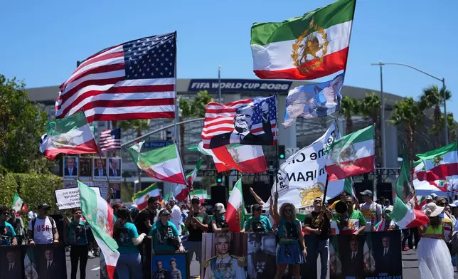 People protest outside Los Angeles Stadium before the World Cup Group G soccer match between Iran and New Zealand in Inglewood, Calif., near Los Angeles, Monday, June 15, 2026. (AP Photo/Jae C. Hong)