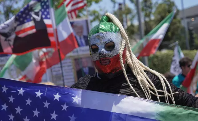 People protest outside Los Angeles Stadium before the World Cup Group G soccer match between Iran and New Zealand in Inglewood, Calif., near Los Angeles, Monday, June 15, 2026 (AP Photo/Ty ONeil)