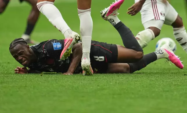 Canada's Ismael Kone falls while sustaining an injury during the World Cup Group B soccer match against Qatar in Vancouver, British Columbia, Thursday, June 18, 2026. (AP Photo/Abbie Parr)