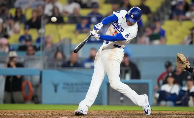 Los Angeles Dodgers' Freddie Freeman hits a solo walk-off home run during the ninth inning of a baseball game against the Los Angeles Angels, Friday, June 5, 2026, in Los Angeles. (AP Photo/Mark J. Terrill)