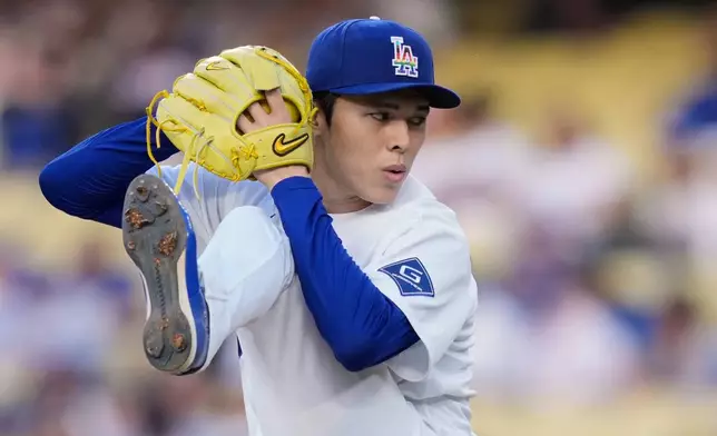 Los Angeles Dodgers starting pitcher Roki Sasaki throws to the plate during the first inning of a baseball game against the Los Angeles Angels, Friday, June 5, 2026, in Los Angeles. (AP Photo/Mark J. Terrill)
