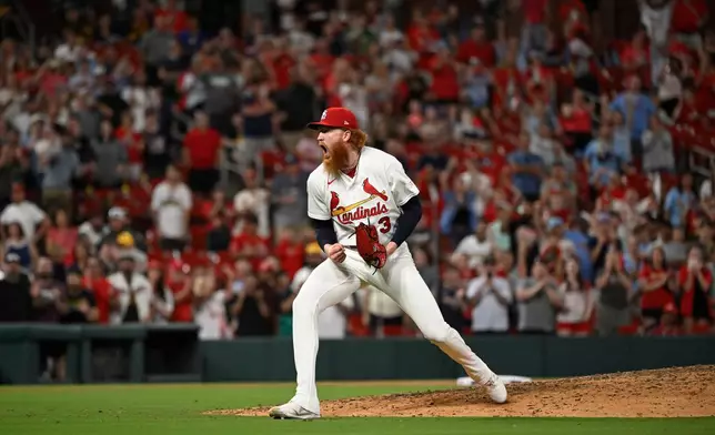 St. Louis Cardinals starting pitcher Dustin May celebrates after the team defeated the San Diego Padres in a baseball game, Monday, June 15, 2026, in St. Louis. (AP Photo/Joe Puetz)