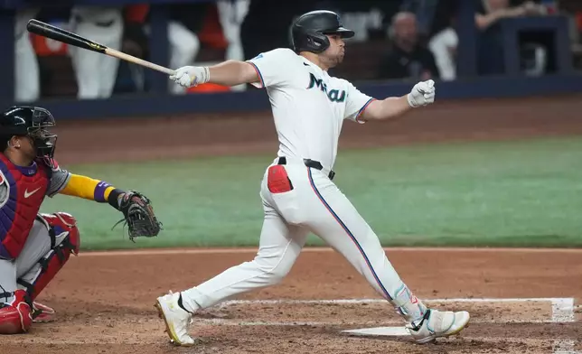 Miami Marlins' Jakob Marsee hits a single during the fourth inning of a baseball game against the Arizona Diamondbacks Tuesday, June 9, 2026, in Miami. (AP Photo/Marta Lavandier)