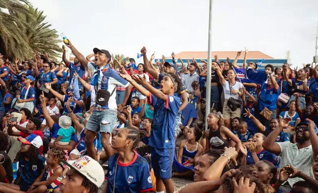 Fans react as they watch a broadcast of the World Cup Group H soccer match between Cape Verde and Spain at a viewing center in Mindelo, São Vicente, Cape Verde, Monday, June 15, 2026. (AP Photo/Queila Fernandes)