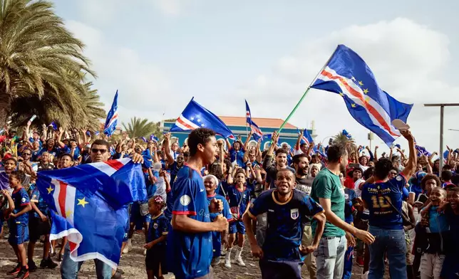 Fans celebrate after the goalless draw in the World Cup Group H soccer match between Cape Verde and Spain at a viewing center in Mindelo, São Vicente, Cape Verde, Monday, June 15, 2026. (AP Photo/Queila Fernandes)