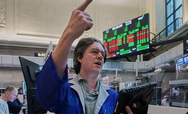 Options trader Doran Swan works on the floor of the New York Stock Exchange, Tuesday, June 16, 2026. (AP Photo/Richard Drew)