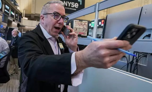 Options trader Joseph D'Arrigo works on the floor of the New York Stock Exchange, Tuesday, June 16, 2026. (AP Photo/Richard Drew)