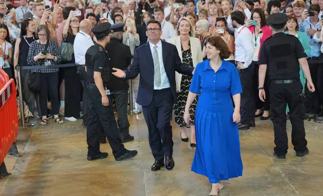 Andy Burnham with colleagues from the Parliamentary Labour Party in Westminster Hall at the Houses of Parliament in central London, as he returns to the House of Commons to take up his seat after winning the Makerfield by-election, Monday June 22, 2026. (Yui Mok/PA via AP)