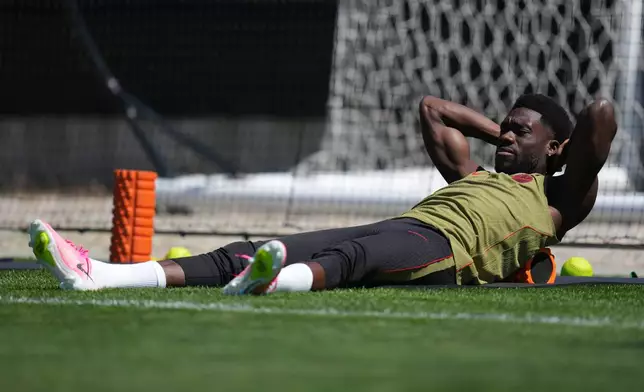 Canada's Alphonso Davies works out during a training session on the eve of the team's World Cup soccer match against Qatar, Wednesday, June 17, 2026, in Vancouver, British Columbia. (AP Photo/Abbie Parr)