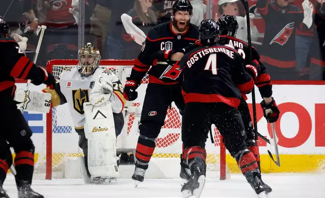 Carolina Hurricanes' Jordan Staal (11) celebrates after his goal against Vegas Golden Knights goaltender Carter Hart (79) during the third period in Game 2 of the NHL hockey Stanley Cup Final series in Raleigh, N.C., Thursday, June 4, 2026. (AP Photo/Karl DeBlaker)