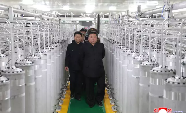 In this photo provided by the North Korean government, its leader Kim Jong Un, front right, visits a new facility to produce nuclear bomb fuels at an undisclosed place in North Korea Wednesday, June 3, 2026. Independent journalists were not given access to cover the event depicted in this image distributed by the North Korean government. The content of this image is as provided and cannot be independently verified. Korean language watermark on image as provided by source reads: "KCNA" which is the abbreviation for Korean Central News Agency. (Korean Central News Agency/Korea News Service via AP)