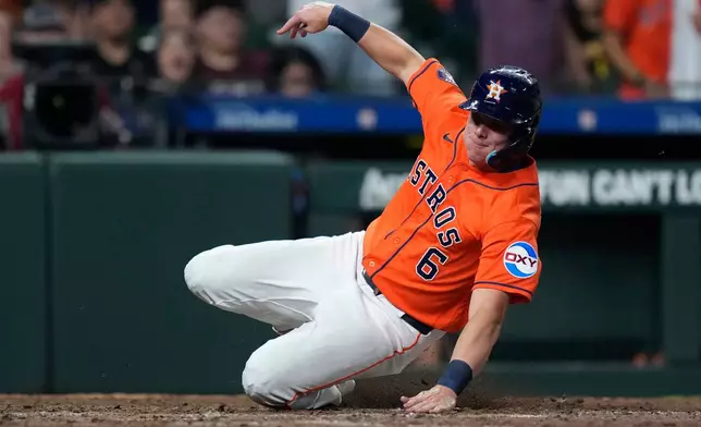 Houston Astros' Jake Meyers scores on a hit by Jeremy Peña during the eighth inning of a baseball game against the Cleveland Guardians, Friday, June 19, 2026, in Houston. (AP Photo/Kevin M. Cox)