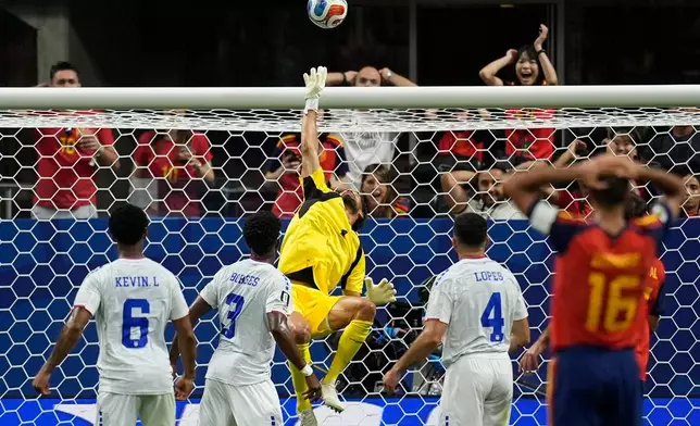 Cape Verde goalkeeper Vozinha (1) makes a save during the World Cup Group H soccer match between Spain and Cape Verde in Atlanta, Monday, June 15, 2026. (AP Photo/Mike Stewart)