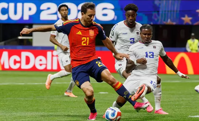 Spain's Mikel Oyarzabal, left, and Cabo Verde's Sidny Lopes Cabral fight for the ball during the World Cup Group H soccer match between Spain and Cape Verde in Atlanta, Monday, June 15, 2026. (AP Photo/Erik S. Lesser)