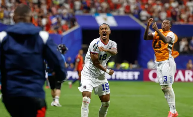 Cabo Verde's Dailon Livramento, center, and Cabo Verde's Sidny Lopes Cabral celebrate after the World Cup Group H soccer match between Spain and Cape Verde in Atlanta, Monday, June 15, 2026. (AP Photo/Erik S. Lesser)