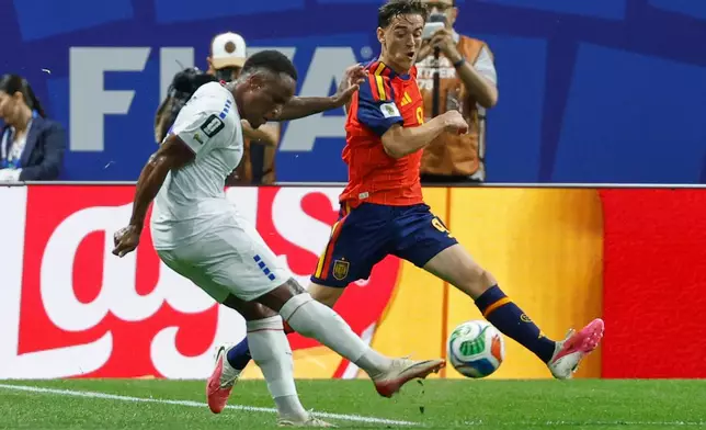 Cabo Verde's Jovane Cabral shoots by Spain's Gavi during the World Cup Group H soccer match between Spain and Cape Verde in Atlanta, Monday, June 15, 2026. (AP Photo/Erik S. Lesser)