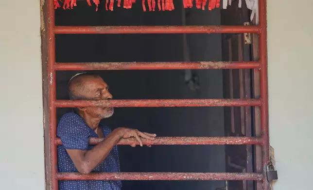 A resident looks outside from his dormitory at a nursing home in Anguruwatota, Sri Lanka, Friday, June 5, 2026.(AP Photo/Eranga Jayawardena)