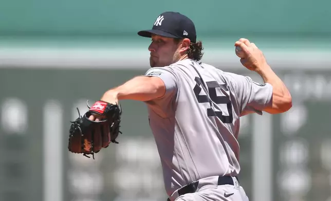 New York Yankees' Gerrit Cole delivers a pitch to a Boston Red Sox batter in the first inning of a baseball game, Saturday, June 27, 2026, in Boston. (AP Photo/Steven Senne)