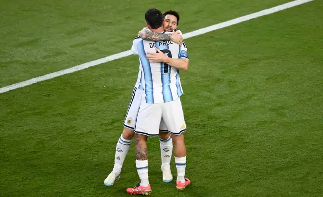 Argentina's Lionel Messi (10) celebrates with Rodrigo de Paul (7) after scoring their opening goal during the World Cup Group J soccer match between Argentina and Algeria in Kansas City, Mo., Tuesday, June 16, 2026. (AP Photo/Reed Hoffmann)