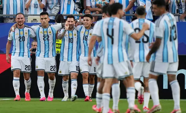 Argentina's Lionel Messi, third left, celebrates with teammates after scoring his team's first goal during the World Cup Group J soccer match between Argentina and Algeria in Kansas City, Mo., Tuesday, June 16, 2026. (AP Photo/Charlie Riedel)