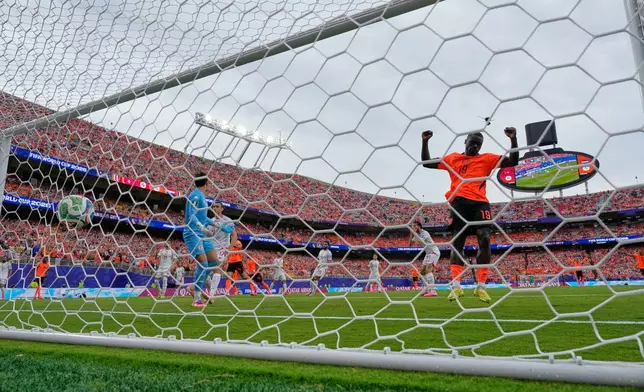 Netherlands' Brian Brobbey (19) celebrates after Tunisia's Ellyes Skhiri (17) scored an own goal during the World Cup Group F soccer match between Tunisia and the Netherlands in Kansas City, Mo., Thursday, June 25, 2026. (AP Photo/Charlie Riedel)