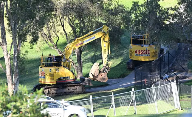 Earthmoving machinery is seen being brought into Victoria Park for preparatory earthworks at the site of the 2032 Olympic Stadium at Brisbane's Victoria Park, Australia, Monday, June 1, 2026. (Darren England/AAP Image via AP)