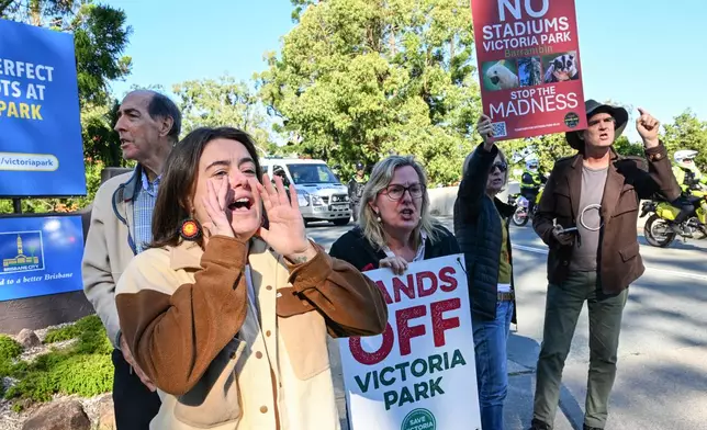 Protesters react at the site of the 2032 Olympic Stadium at Brisbane's Victoria Park, Australia, Monday, June 1, 2026. (Darren England/AAP Image via AP)