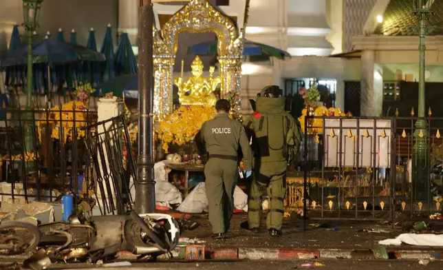 FILE - Explosive Ordnance Disposal officers enter the Erawan Shrine after an explosion in Bangkok, on Aug. 17, 2015. (AP Photo/Sackchai Lalit, File)