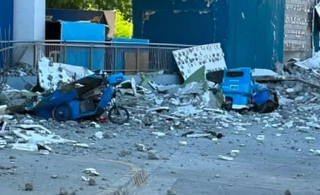 This shows vehicles damaged by debris after powerful earthquake in the Mindanao region, Philippines Monday, June 8, 2026. (Ernesto Torres Jr via AP)