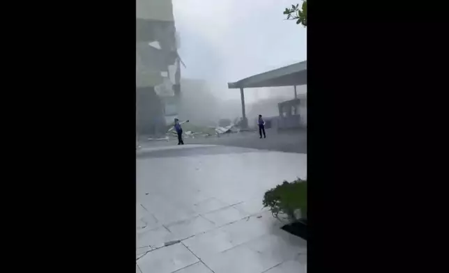 This image from a video shows dust and debris outside a building after a powerful earthquake in General Santos city on the island of Mindanao, Philippines Monday, June 8, 2026. (Ernesto Torres Jr via AP)
