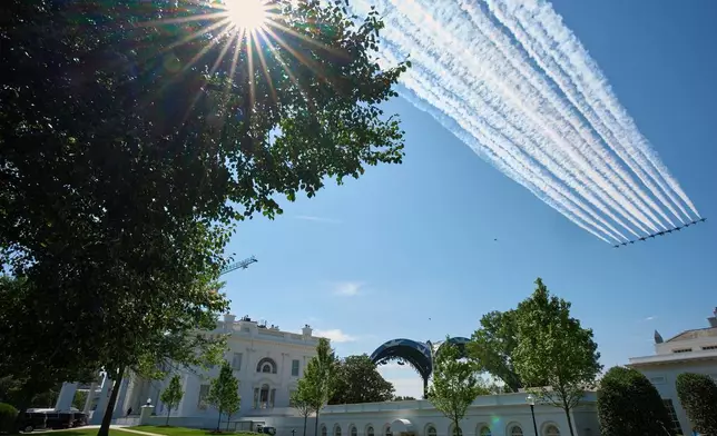 Thunderbirds and Blue Angels do a practice flyover of the White House, Octagon and Washington Monument, Friday, June 12, 2026, in Washington, ahead of the UFC fight. (AP Photo/Jacquelyn Martin)