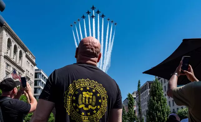 UFC President and CEO Dana White watches the U.S. Air Force Thunderbirds and U.S. Navy Blue Angels fly over the White House, before the UFC Freedom 250 fights on the South Lawn of the White House, Friday, June 12, 2026, in Washington. (AP Photo/Alex Brandon)