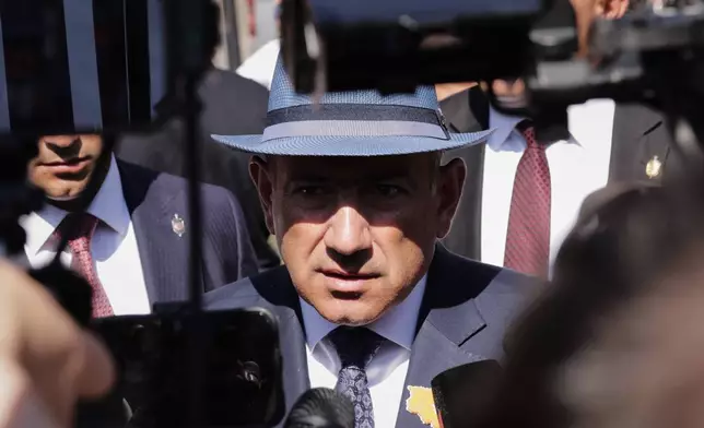 Armenian Prime Minister Nikol Pashinyan speaks to journalists after voting at a polling station during the parliamentary election in Yerevan, Armenia, Sunday, June 7, 2026. (AP Photo/Anthony Pizzoferrato)