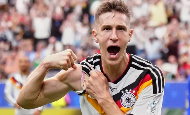 Germany's Nico Schlotterbeck celebrates after scoring his side's second goal during the World Cup Group E soccer match between Germany and Curacao in Houston, Sunday, June 14, 2026. (AP Photo/Karen Warren)