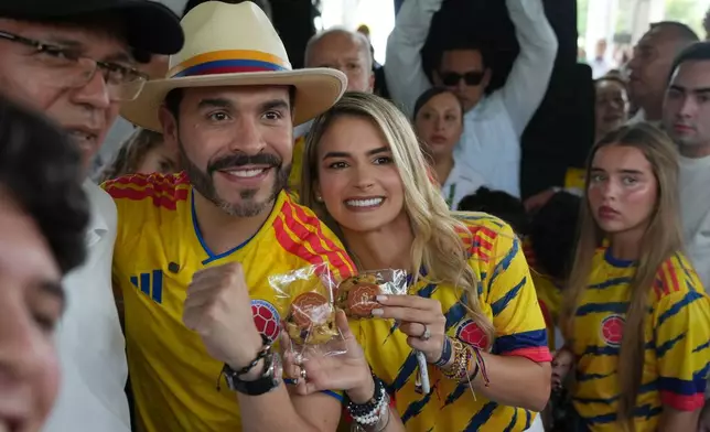 Presidential candidate Abelardo de la Espriella of the opposition Defenders of the Motherland movement and his wife Ana Lucia Pineda gesture after voting during the runoff election in Barranquilla, Colombia, Sunday, June 21, 2026. ( (AP Photo/Rodrigo Abd)