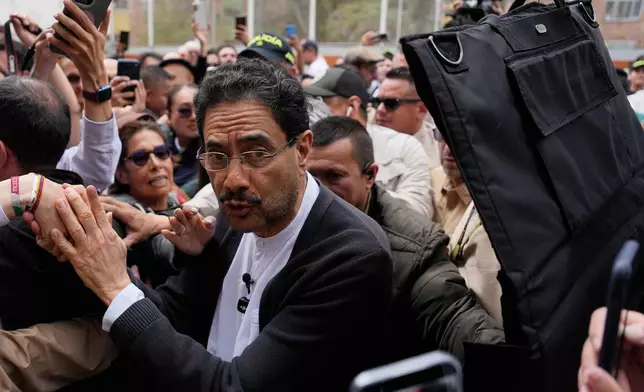 Presidential candidate Ivan Cepeda of the ruling Historic Pact coalition arrives to vote during the runoff election in Bogota, Colombia, Sunday, June 21, 2026. (AP Photo/Fernando Vergara)