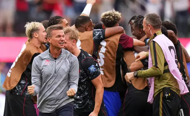 Canada head coach Jesse Marsch celebrates after Stephen Eustaquio scored their opening goal against South Africa during the World Cup round of 32 soccer match in Inglewood, Calif., near Los Angeles, Sunday, June 28, 2026. (AP Photo/Andre Penner)