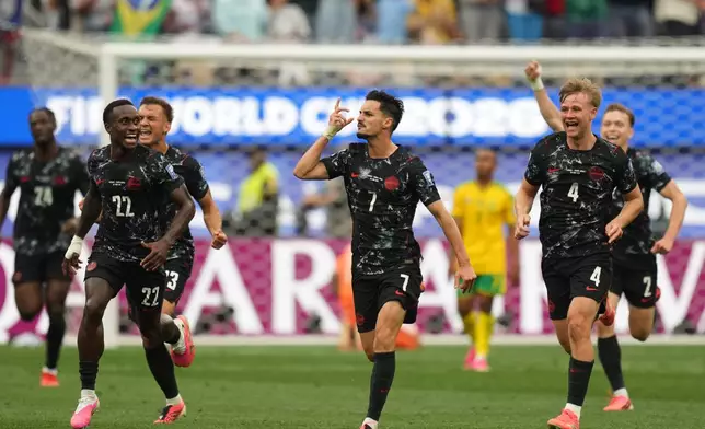 Canada's Stephen Eustaquio (7) celebrates scoring their opening goal against South Africa during the World Cup round of 32 soccer match in Inglewood, Calif., near Los Angeles, Sunday, June 28, 2026. (AP Photo/Andre Penner)