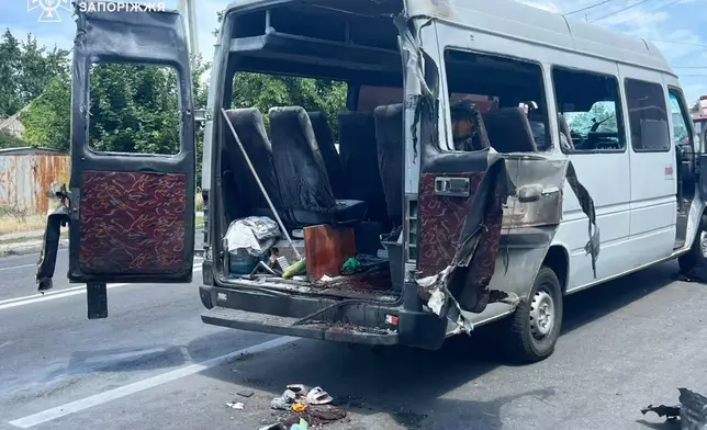 In this photo provided by the Ukrainian Emergency Services on Monday, June 29, 2026, a passengers minivan is seen damaged after a Russian drone strike in Dnipropetrovsk region, Ukraine. (Ukrainian Emergency Service via AP)