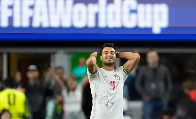 Iran's Shoja Khalilzadeh (4) reacts at the end of the World Cup Group G soccer match between Egypt and Iran in Seattle, Friday, June 26, 2026. (AP Photo/Lindsey Wasson)