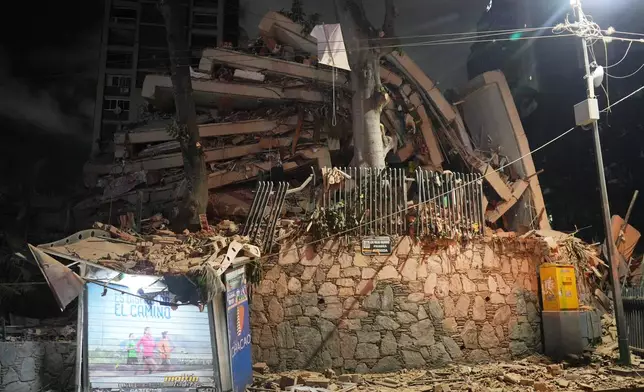 A collapsed building after an earthquake in Caracas, Venezuela, Wednesday, June 24, 2026. (AP Photo/Adrian Naranjo)