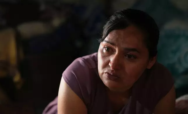 Mirsy Maricela Alva Lopez, a Guatemalan migrant who has been separated from her son Ederson twice, cries during an interview at her parents' house in San Martín Cuchumatán, Guatemala, Thursday, April 30, 2026. (AP Photo/Moises Castillo)