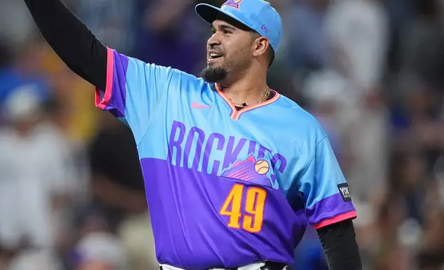 Colorado Rockies relief pitcher Antonio Senzatela reacts after getting Pittsburgh Pirates' Jared Triolo to hit into a double play with the bases loaded to end a baseball game Friday, June 19, 2026, in Denver. (AP Photo/David Zalubowski)
