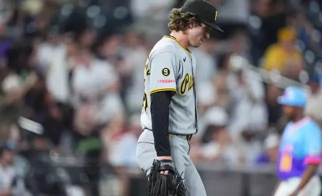 Pittsburgh Pirates relief pitcher Mason Montgomery reacts after giving up a two-run double to Colorado Rockies pinch hitter Braxton Fulford in the eighth inning of a baseball game Friday, June 19, 2026, in Denver. (AP Photo/David Zalubowski)