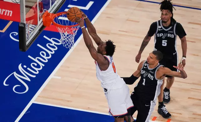 New York Knicks forward Og Anunoby (8) shoots during Game 3 of the NBA Finals basketball series against the San Antonio Spurs, Monday, June 8, 2026, in New York. (AP Photo/Yuki Iwamura)